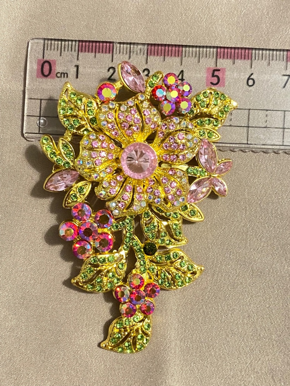 Set of two elegant, elaborate, broaches, gold tone